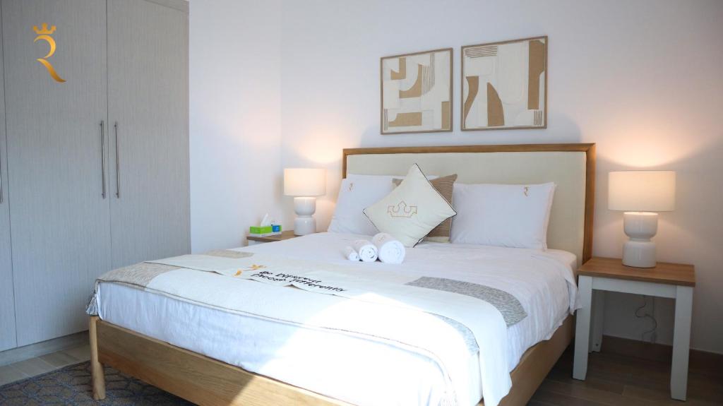 Postelja oz. postelje v sobi nastanitve Cozy 1BR Apartment Yas Island