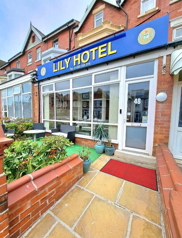 a hotel with a sign on the front of a building at OYO Lily Hotel Blackpool in Blackpool