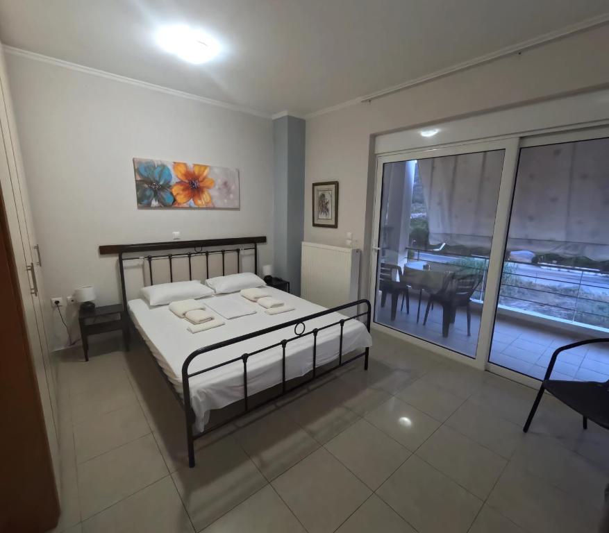 Postel nebo postele na pokoji v ubytování Nafplio BREEZE Άνετη διώροφη κατοικία από 4 έως 9 επισκέπτες