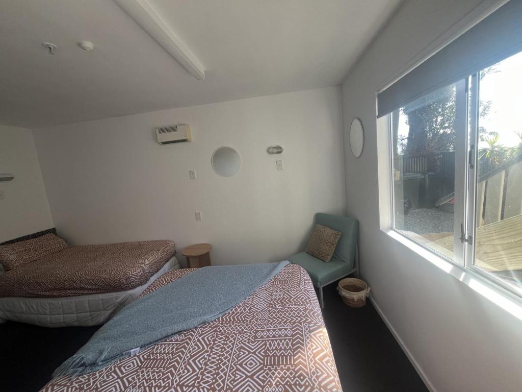 Postel nebo postele na pokoji v ubytování Kaikoura Seaside lodge