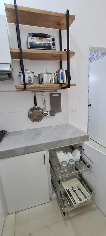 Η κουζίνα ή μικρή κουζίνα στο Bahay Goa Apartment