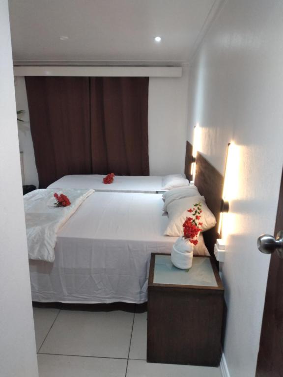 Postel nebo postele na pokoji v ubytování Nadi Airport Transit Hotel