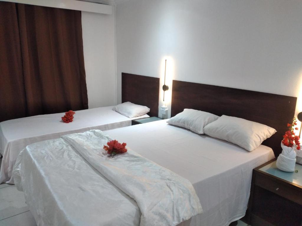 Postel nebo postele na pokoji v ubytování Nadi Airport Transit Hotel