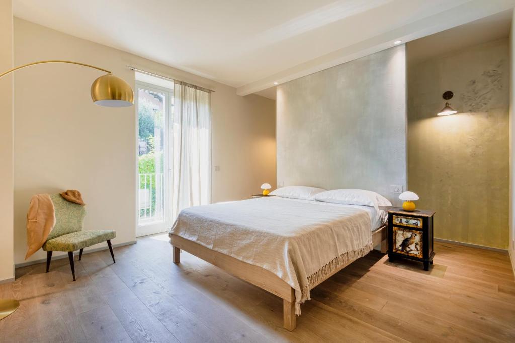 Postel nebo postele na pokoji v ubytování ASILO in BAROLO
