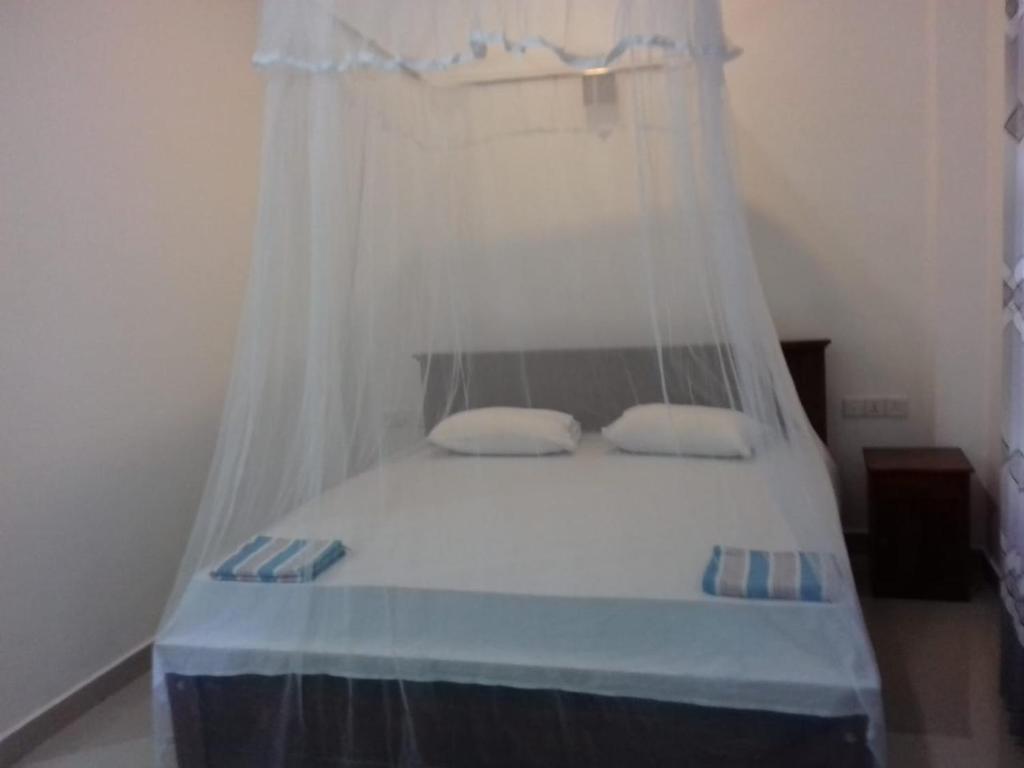 Postel nebo postele na pokoji v ubytování Hiru Resort Inn
