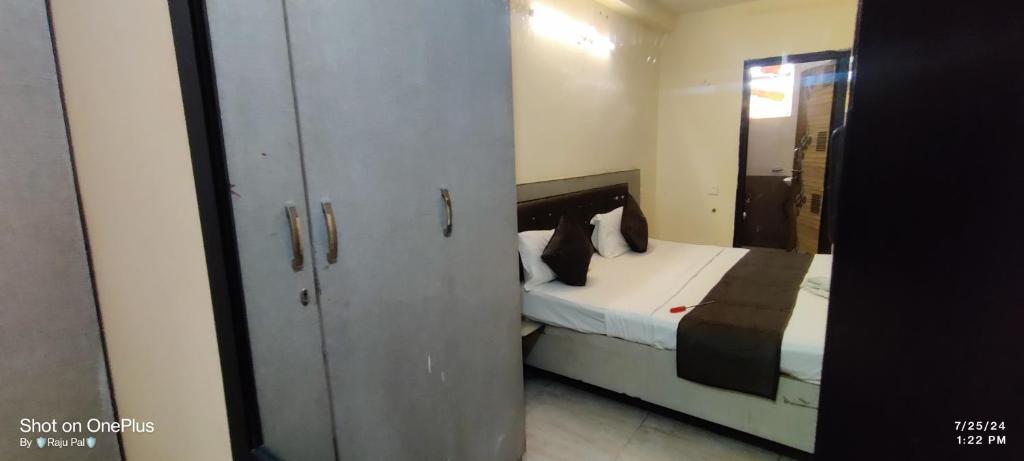 Ένα ή περισσότερα κρεβάτια σε δωμάτιο στο Hotel Prime Stay