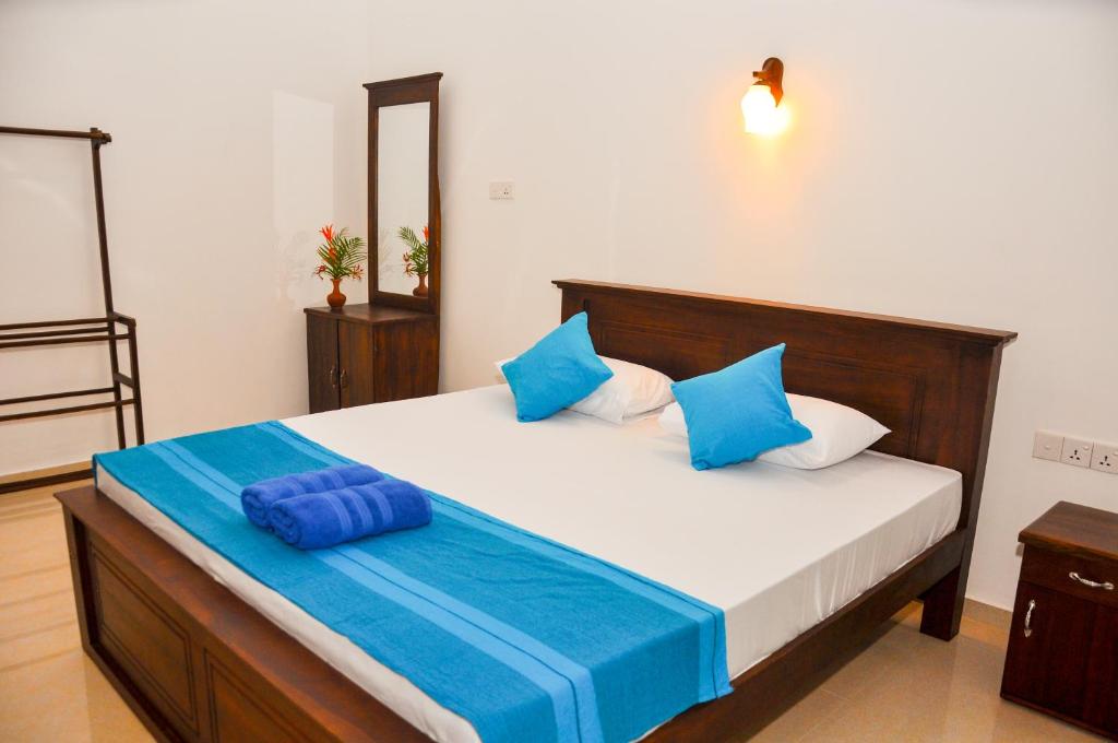 Postel nebo postele na pokoji v ubytování Hiru Resort Inn
