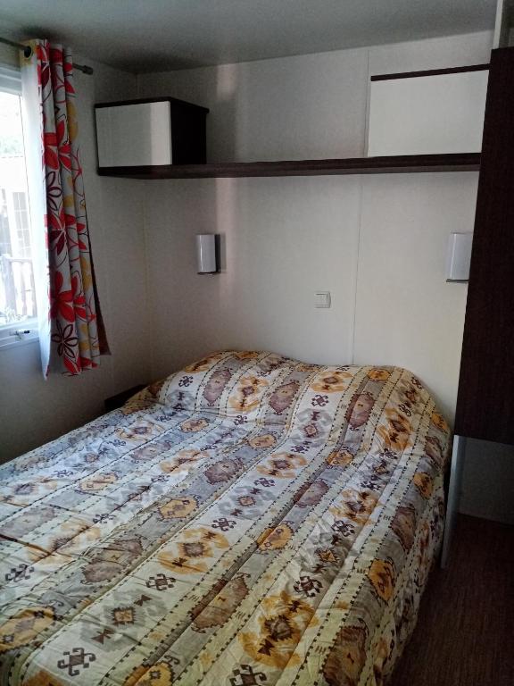 Postel nebo postele na pokoji v ubytování Mobil-home