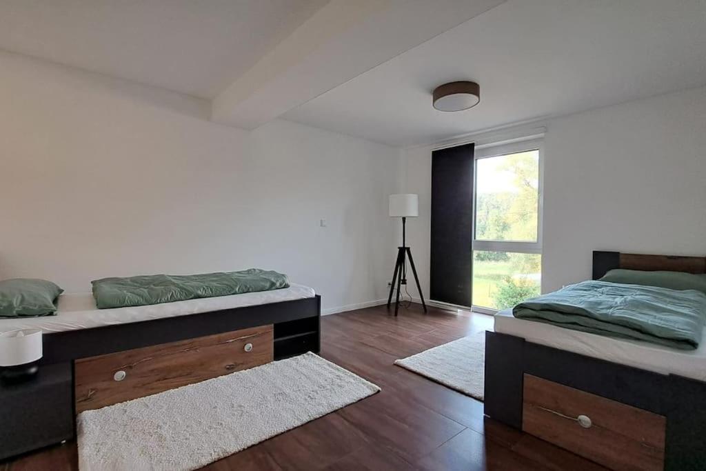 Postel nebo postele na pokoji v ubytování Ferienwohnung im Thüringer Wald