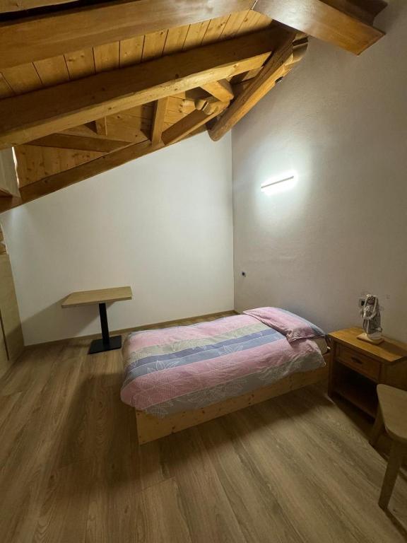 Postel nebo postele na pokoji v ubytování B&B antico tabià dolomitico