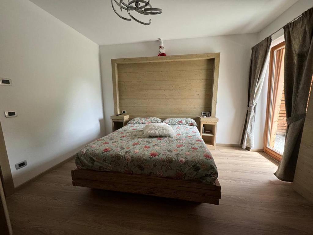Postel nebo postele na pokoji v ubytování B&B antico tabià dolomitico