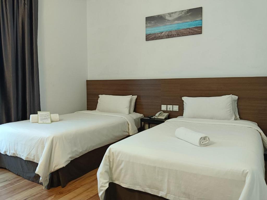 Katil atau katil-katil dalam bilik di Fuller Hotel