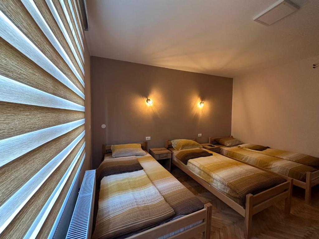 Postel nebo postele na pokoji v ubytování Apartman Pogled Arilje
