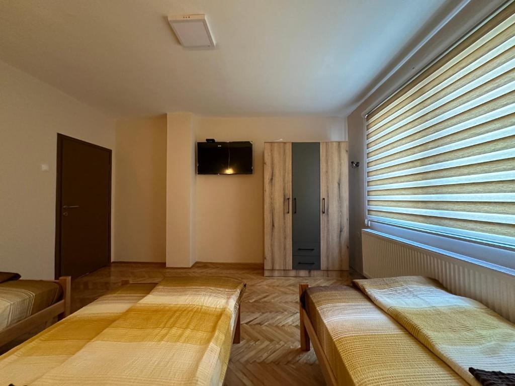 Postel nebo postele na pokoji v ubytování Apartman Pogled Arilje