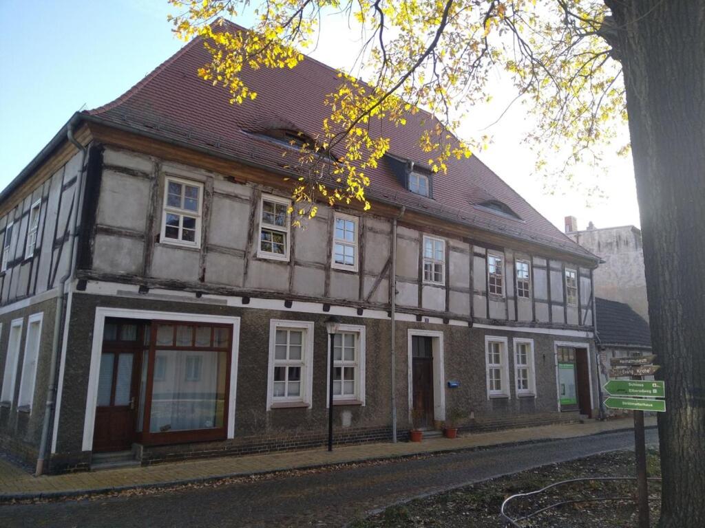 an old building on the side of a street at Forsthaus Nicolai in Pretzsch