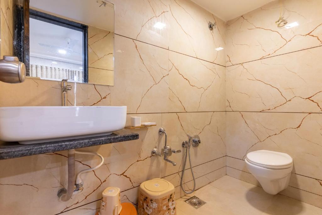 Koupelna v ubytování Hotel Noble Inn, Ahmedabad