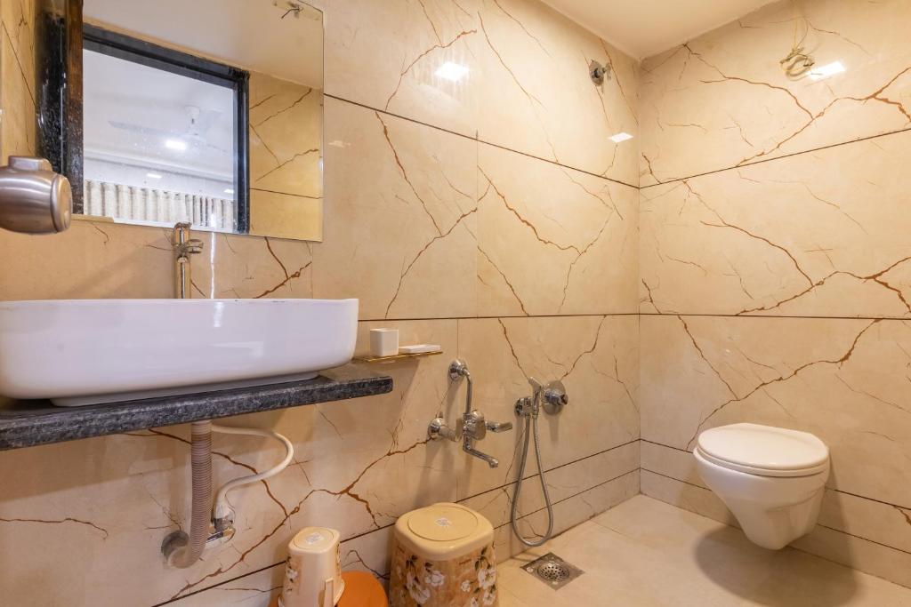Koupelna v ubytování Hotel Noble Inn, Ahmedabad