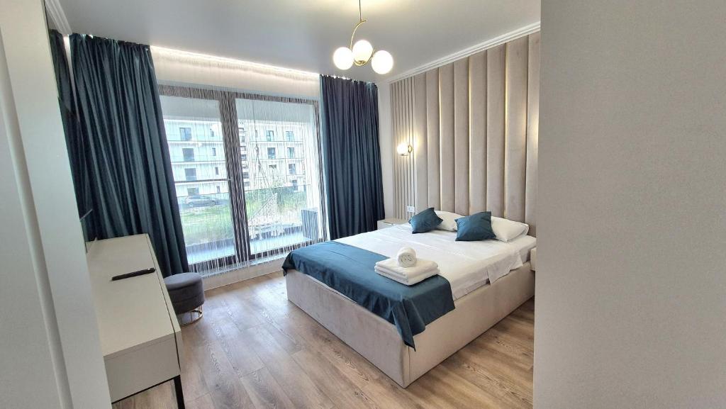 En eller flere senge i et værelse på The Great Sofi Residence A6