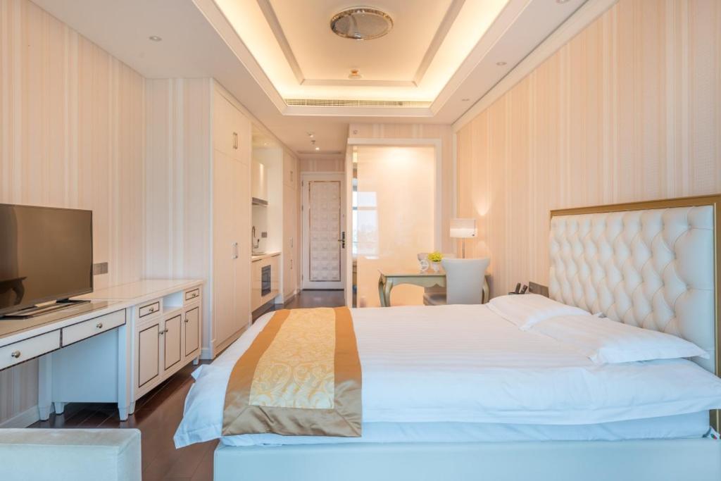 Postel nebo postele na pokoji v ubytování Xiamen Ocean View Suite - Xiamen University Twin Towers Branch