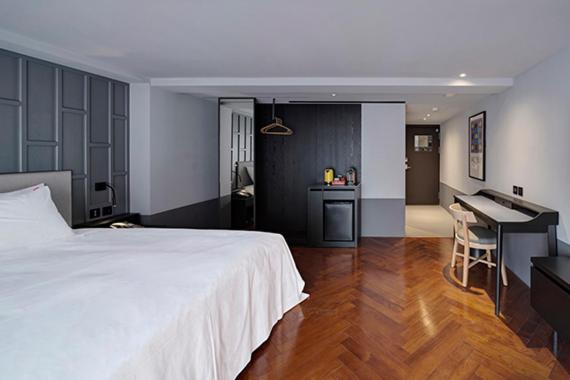 Postel nebo postele na pokoji v ubytování Reddot Hotel
