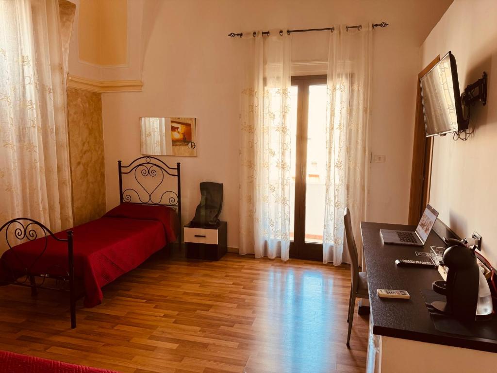 Televízia a/alebo spoločenská miestnosť v ubytovaní B&B Porta Grande