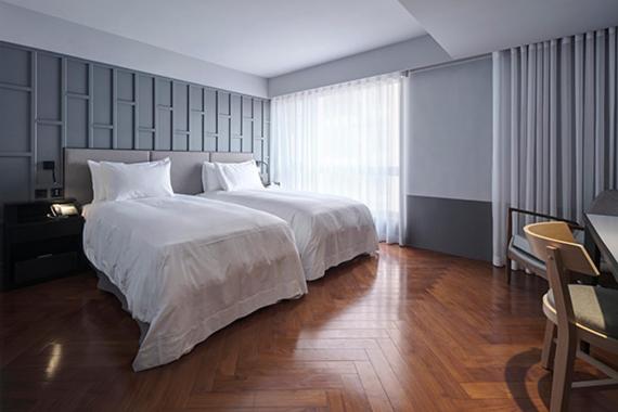 Postel nebo postele na pokoji v ubytování Reddot Hotel