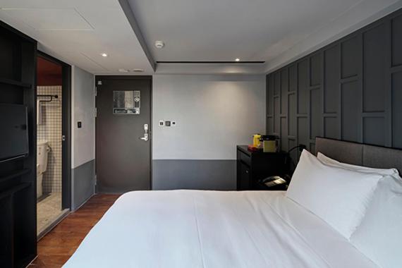 Postel nebo postele na pokoji v ubytování Reddot Hotel