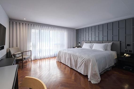 Postel nebo postele na pokoji v ubytování Reddot Hotel