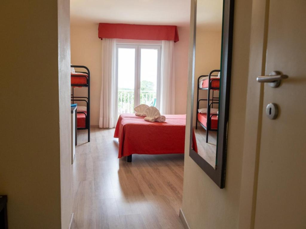 Postel nebo postele na pokoji v ubytování Family Hotel Alexander - Azzurro Club