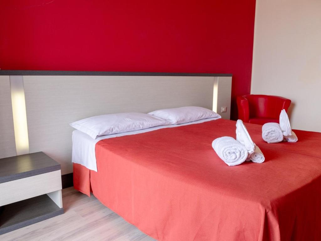Postel nebo postele na pokoji v ubytování Family Hotel Alexander - Azzurro Club