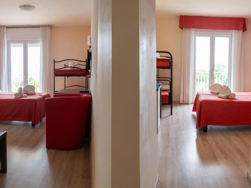 Postel nebo postele na pokoji v ubytování Family Hotel Alexander - Azzurro Club