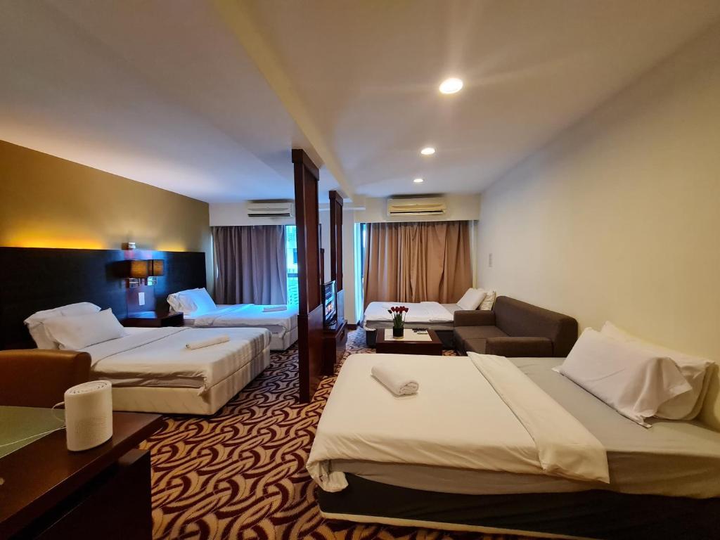 Postel nebo postele na pokoji v ubytování SUN GARDEN Studio and Residences at South China Sea Place Suites