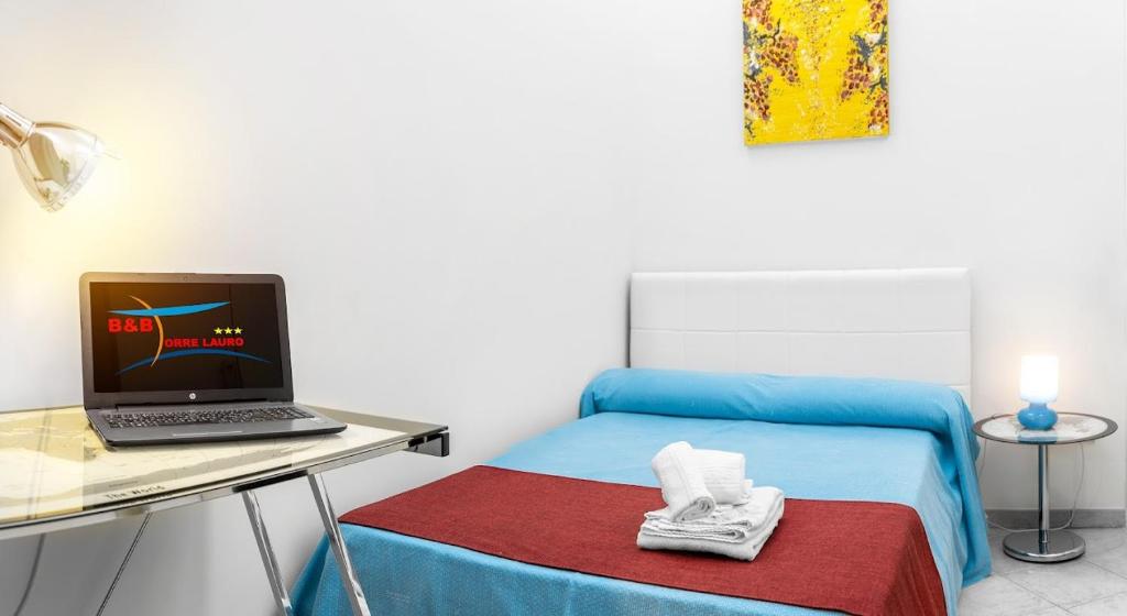 Postel nebo postele na pokoji v ubytování B&B Torre Lauro