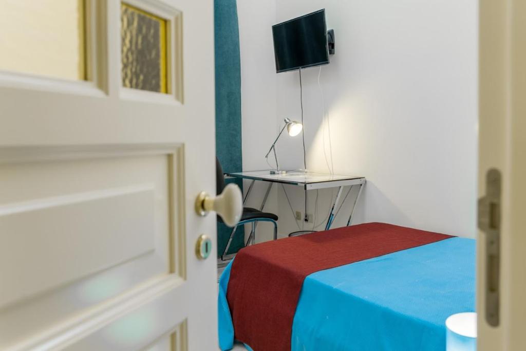 Postel nebo postele na pokoji v ubytování B&B Torre Lauro