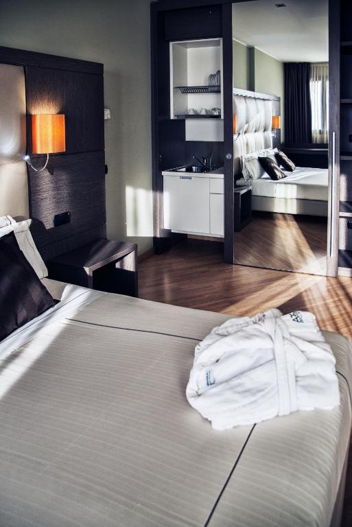 Postel nebo postele na pokoji v ubytování Acca Palace AA Hotels