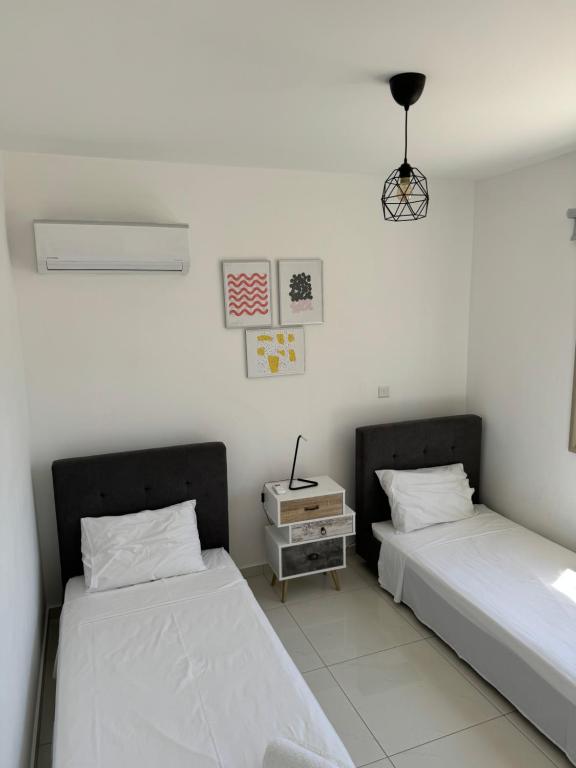 Postel nebo postele na pokoji v ubytování Villa Naxos