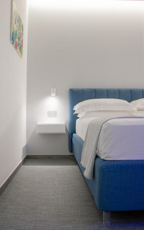 Postel nebo postele na pokoji v ubytování Papavero Giallo B&B