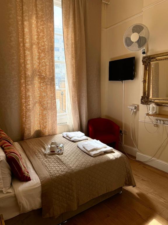 Postel nebo postele na pokoji v ubytování ABC Hyde Park Hotel