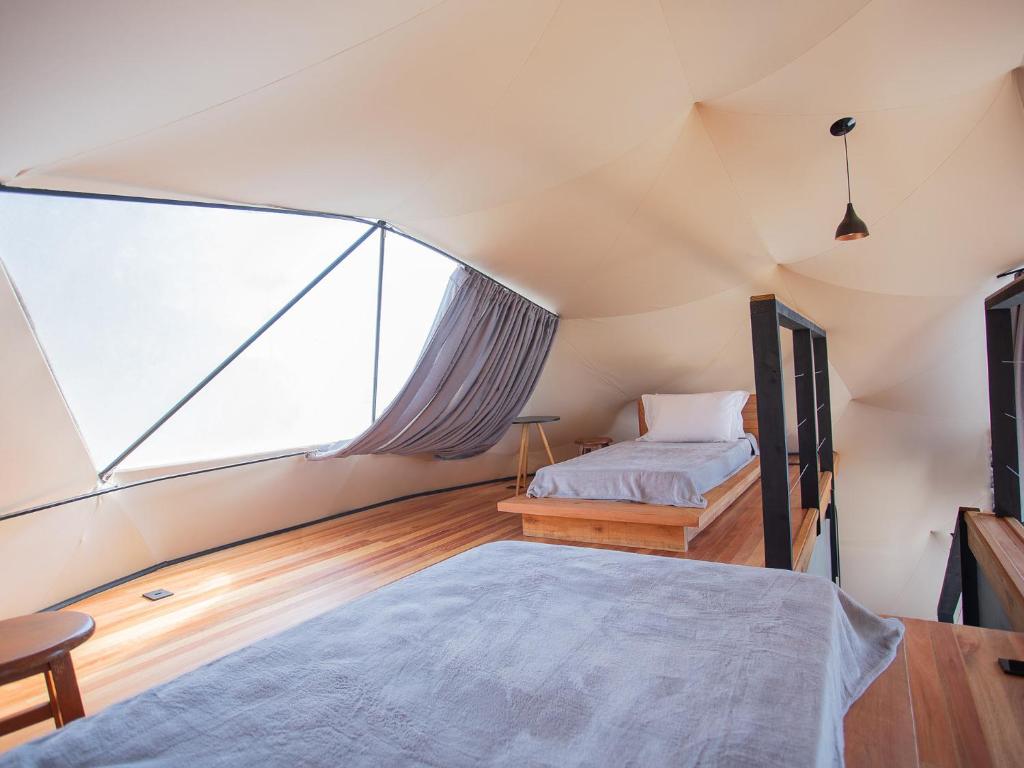 Voodi või voodid majutusasutuse Orion Glamping Hospedagem Domo Geodésico em Urubici toas