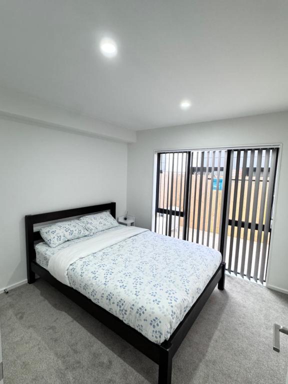 Postel nebo postele na pokoji v ubytování 3BR Auckland Holiday Home near Outlet shops and Costco
