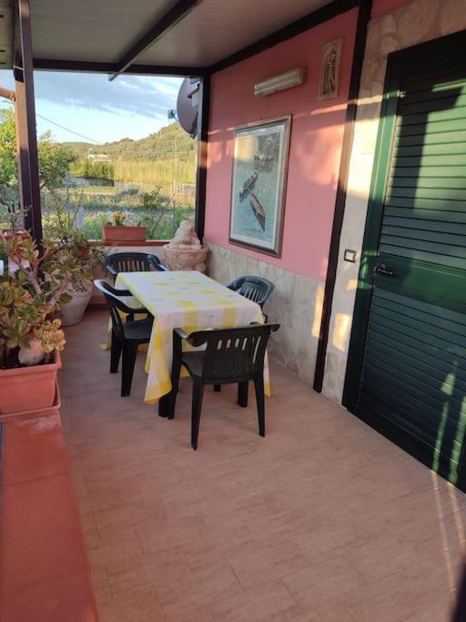 a patio with a table and chairs on a house at casa vacanza Teresa 2 in Vieste