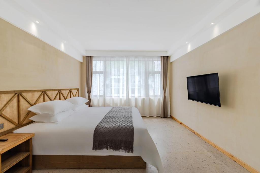 Letto o letti in una camera di 问安民宿（黄山风景区店）