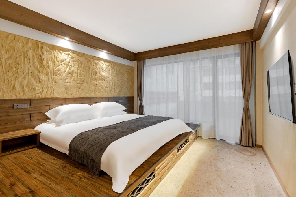 Letto o letti in una camera di 问安民宿（黄山风景区店）