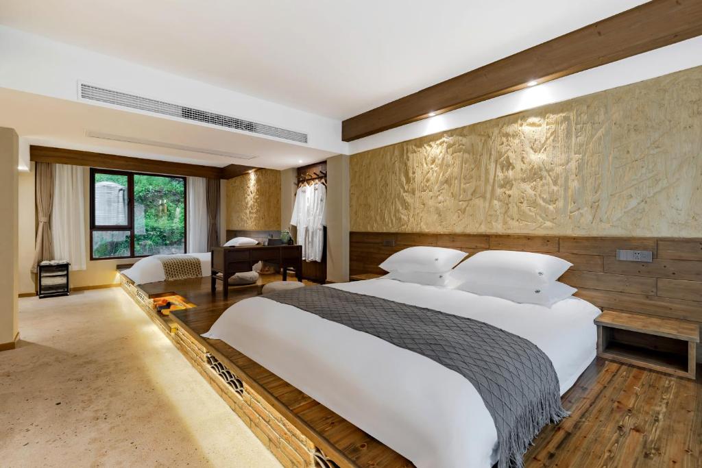 Letto o letti in una camera di 问安民宿（黄山风景区店）