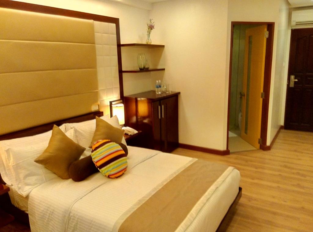Postel nebo postele na pokoji v ubytování Shore Time Hotel Boracay