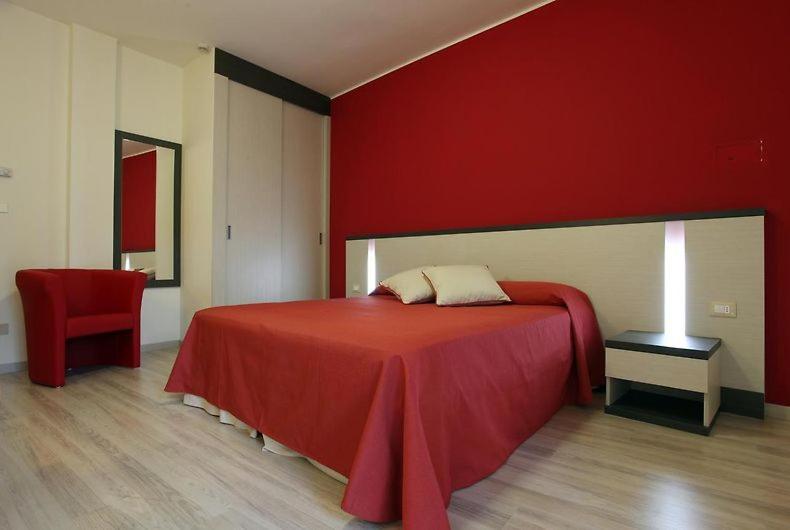 Postel nebo postele na pokoji v ubytování Family Hotel Alexander - Azzurro Club