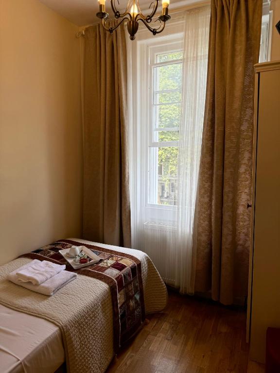 Postel nebo postele na pokoji v ubytování ABC Hyde Park Hotel