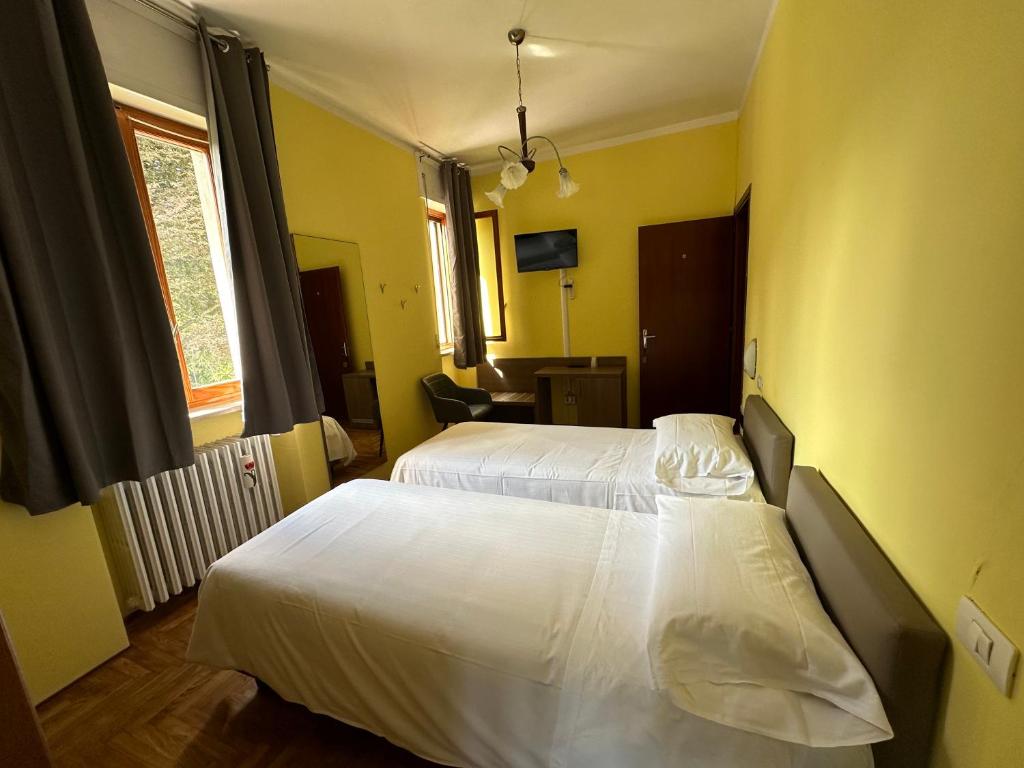 Postel nebo postele na pokoji v ubytování Albergo LA COLDRA