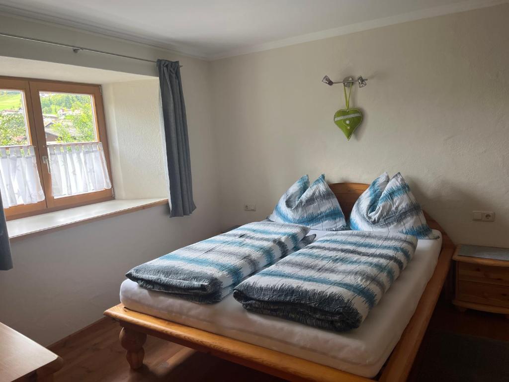 A bed or beds in a room at Landhaus Ganzer