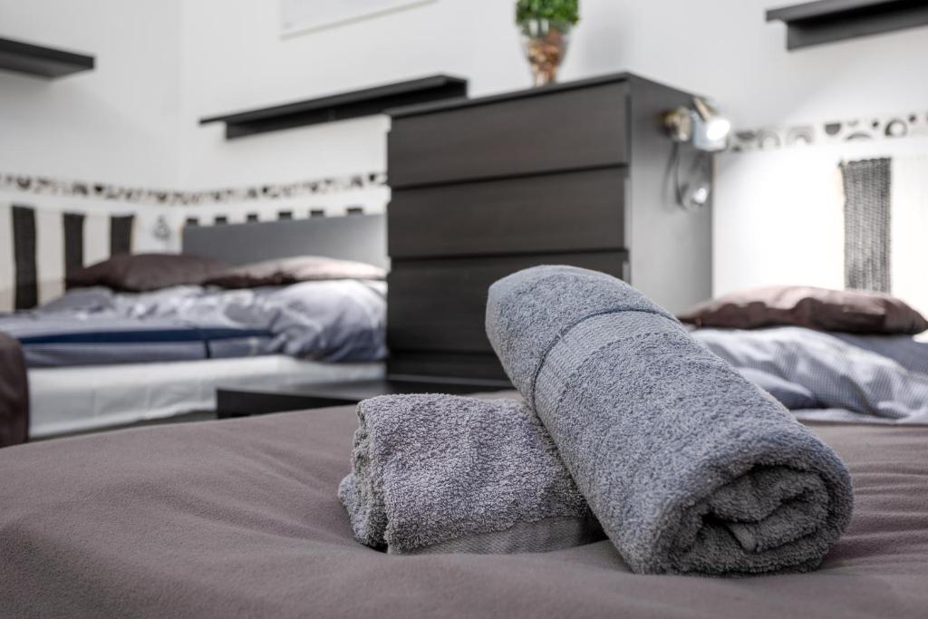 Posteľ alebo postele v izbe v ubytovaní Gecko Centrum Studio Apartman